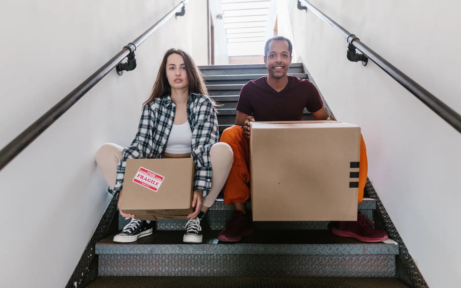 Carefully packed household boxes and furniture protected for export shipping
