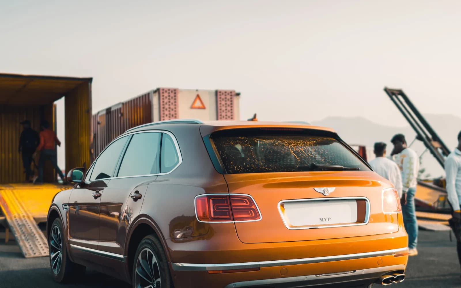 Car secured to a roll-on roll-off deck ready for vehicle shipping